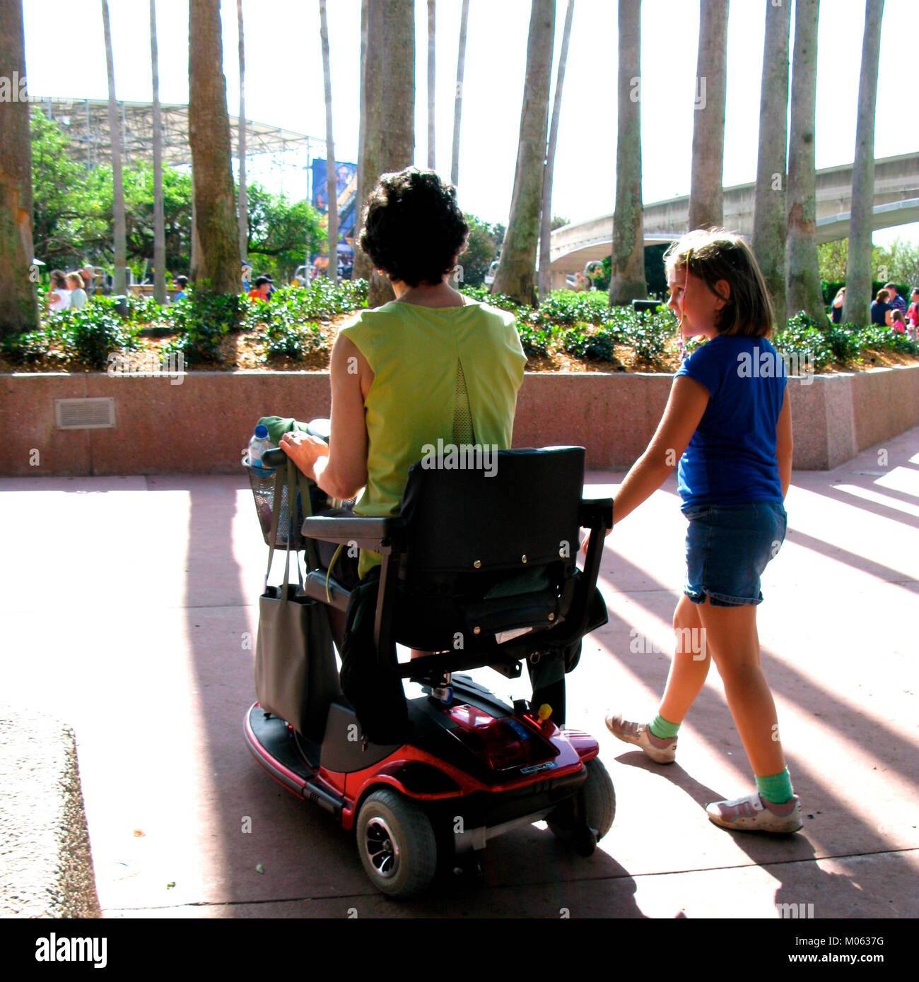 visitors on wheelchair, epcot center, orlando, florida, usa Stock Photo