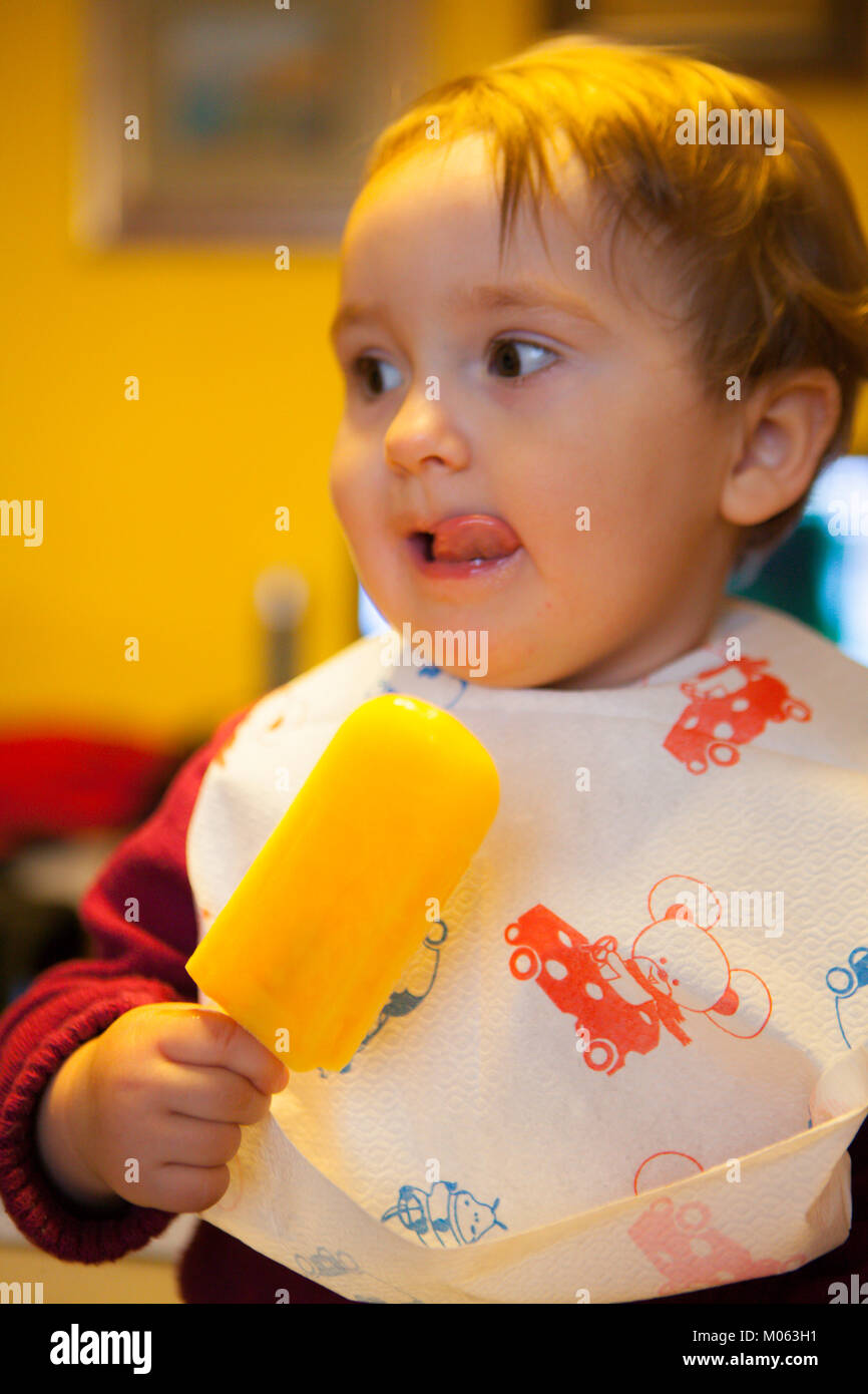 baby girl with an ice lolly Stock Photo Alamy