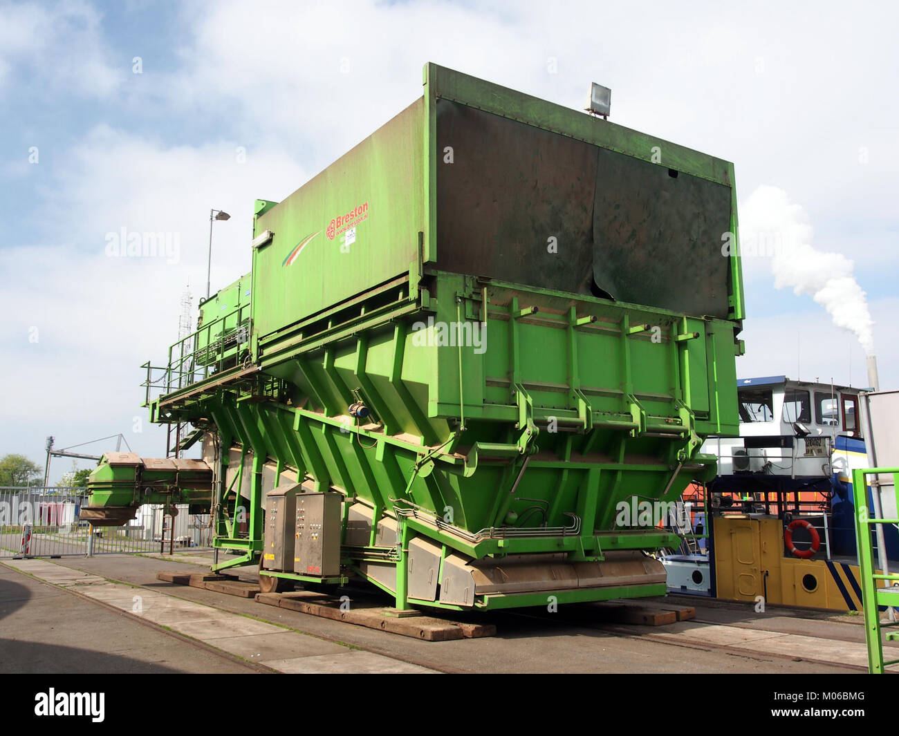 This image captures the bulkhandling ship (un)loader, used for transporting goods in maritime industries, showcasing its design and function in cargo handling. Stock Photo