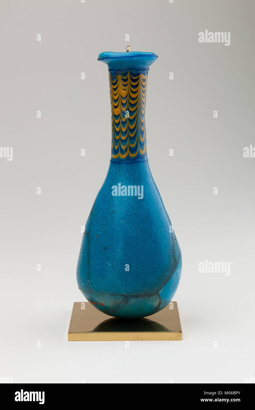 This glass or ceramic bottle demonstrates container-making techniques ...
