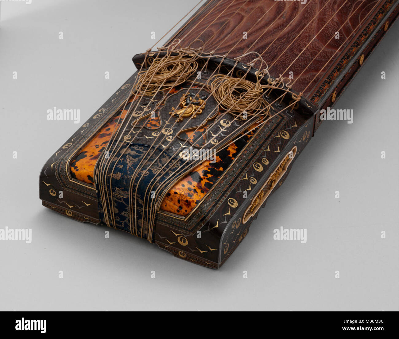 The Koto is a traditional Japanese stringed instrument with a long ...