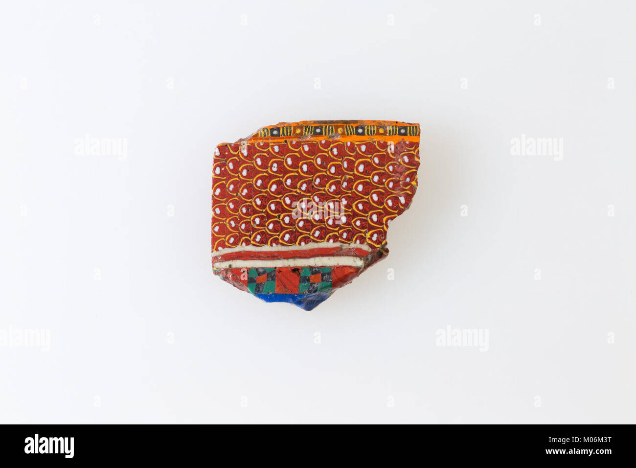 This inlay fragment displays a feather border pattern, exemplifying ...