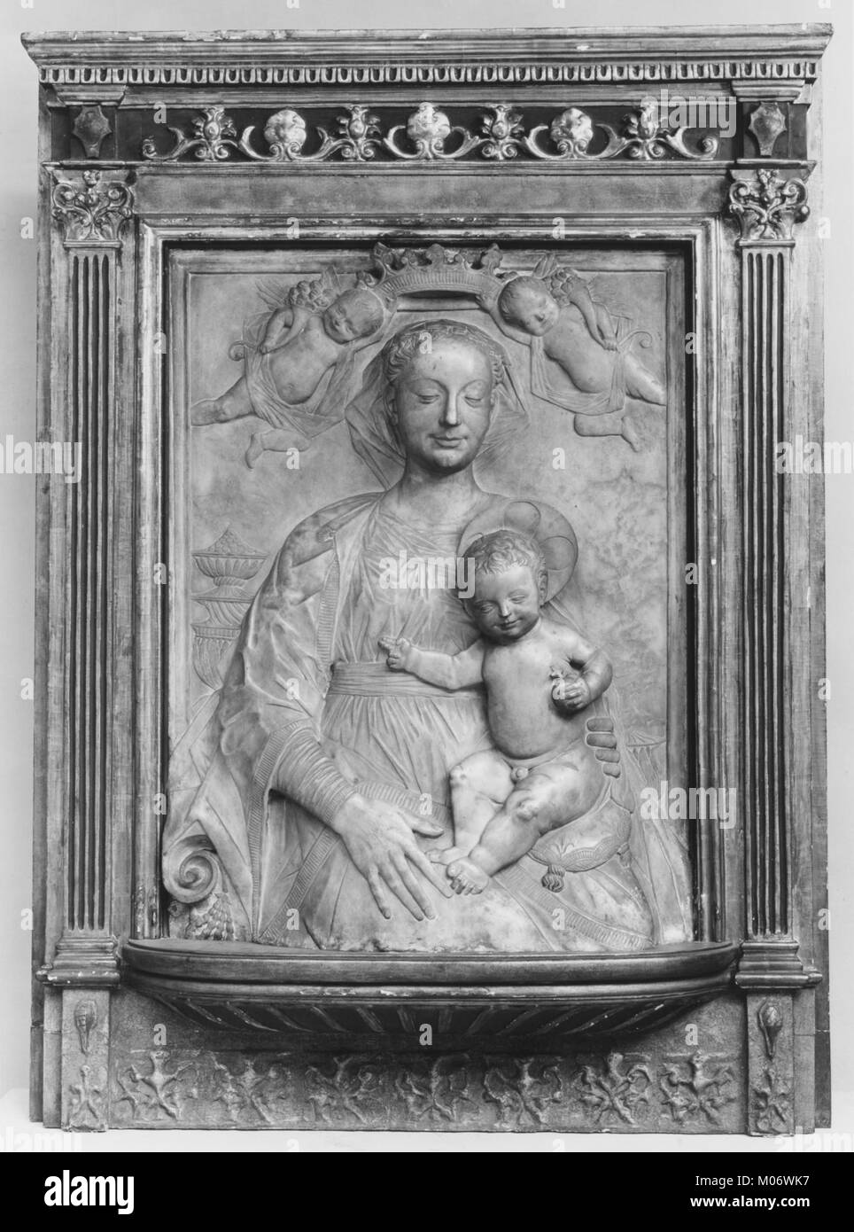 This artwork depicts the Madonna and Child crowned by angels ...