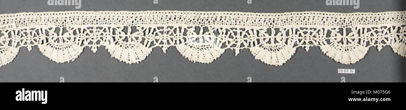 This lace border features delicate patterns, showcasing the intricacy ...