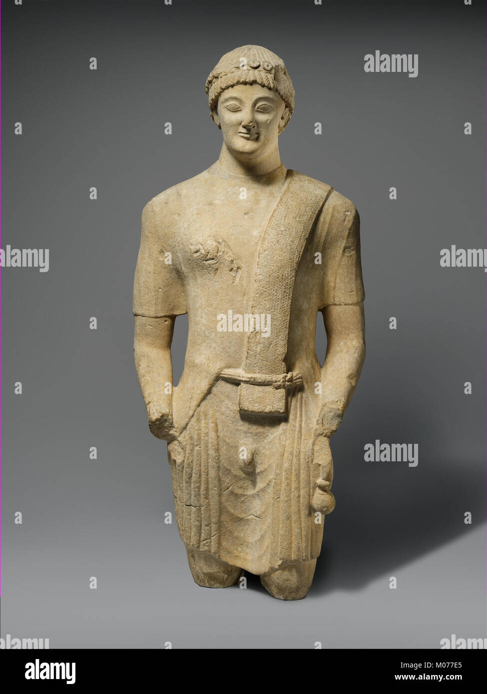 Limestone Statue Example A limestone statue of a male votary, representing devotional art and ...