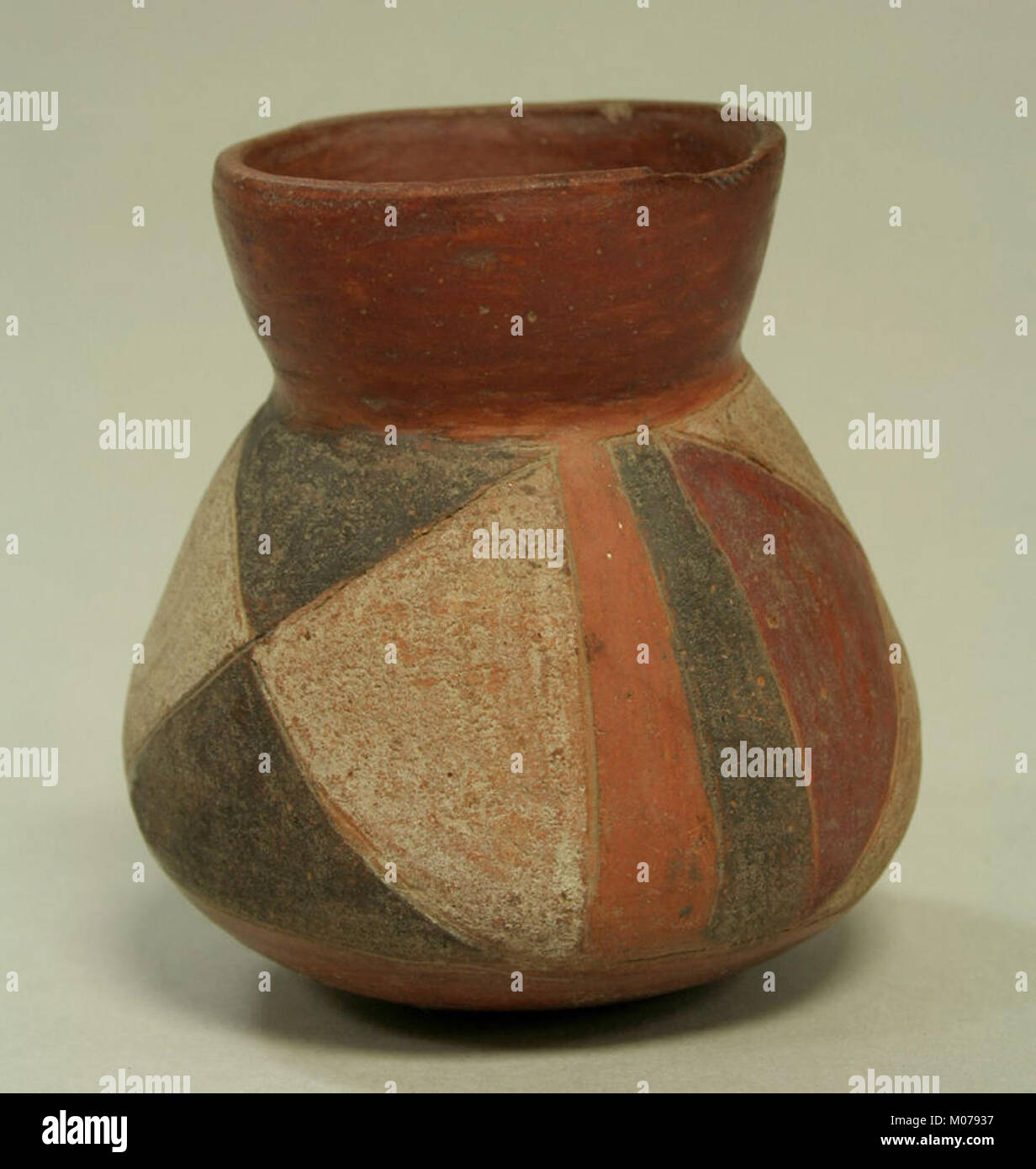 This jar, made of ceramic, is an example of functional pottery with ...