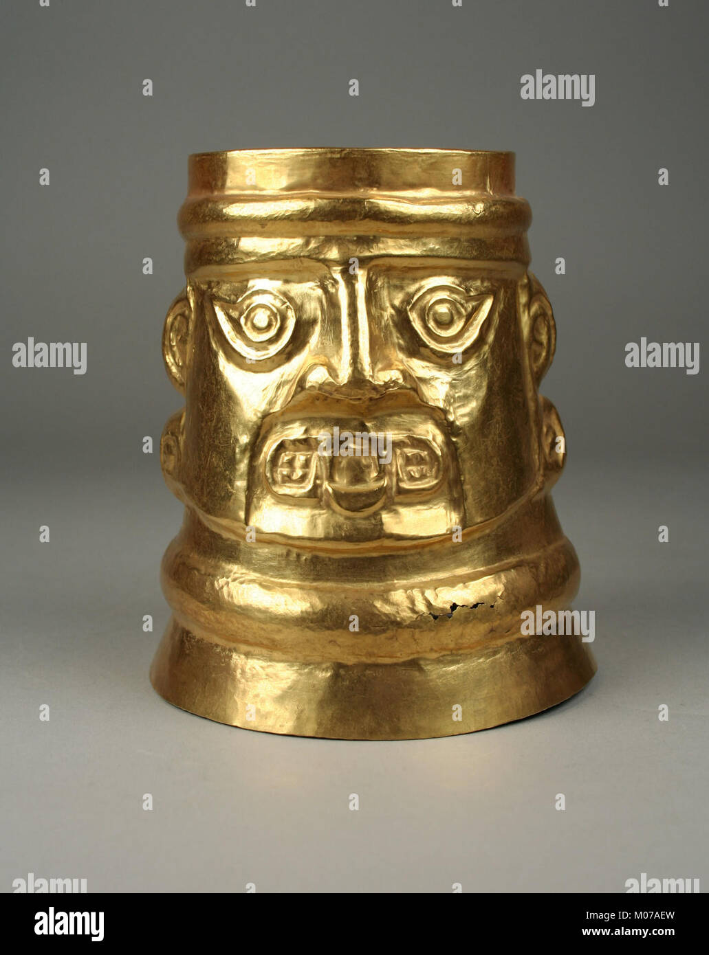This inverse-face beaker from the MET collection features human faces ...