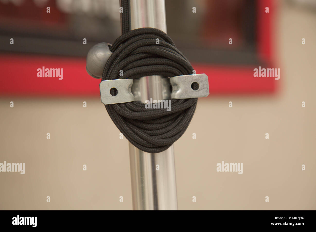 Black rope attached metallic construction Stock Photo - Alamy