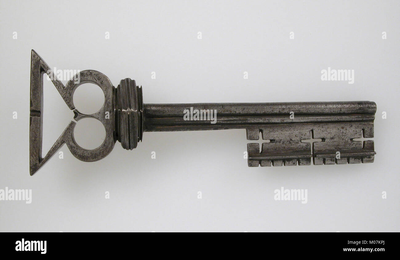 Ancient Key Examples A small ancient metal key used for locking doors or containers ...