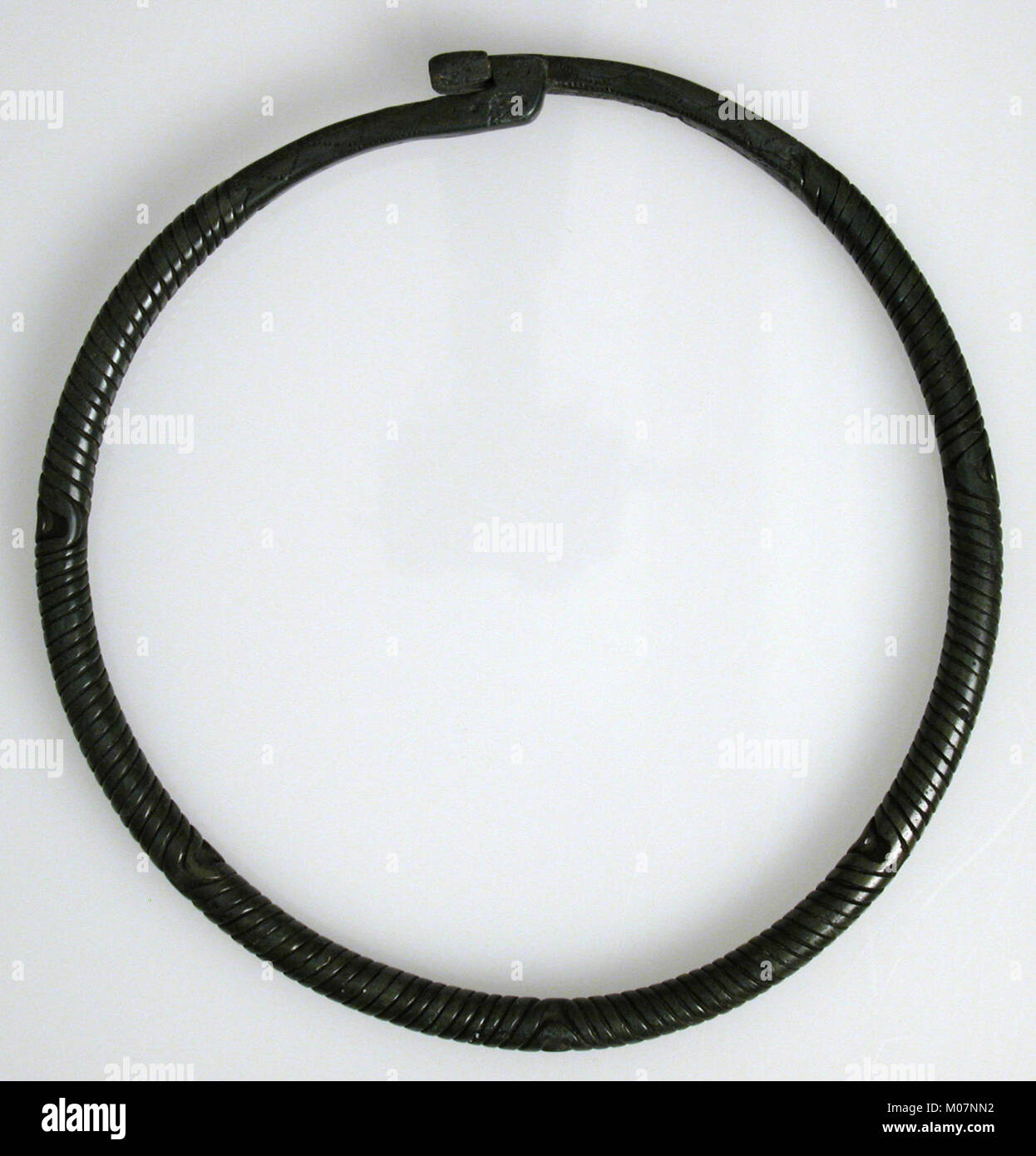 This neck ring (torque) demonstrates ancient jewelry design ...