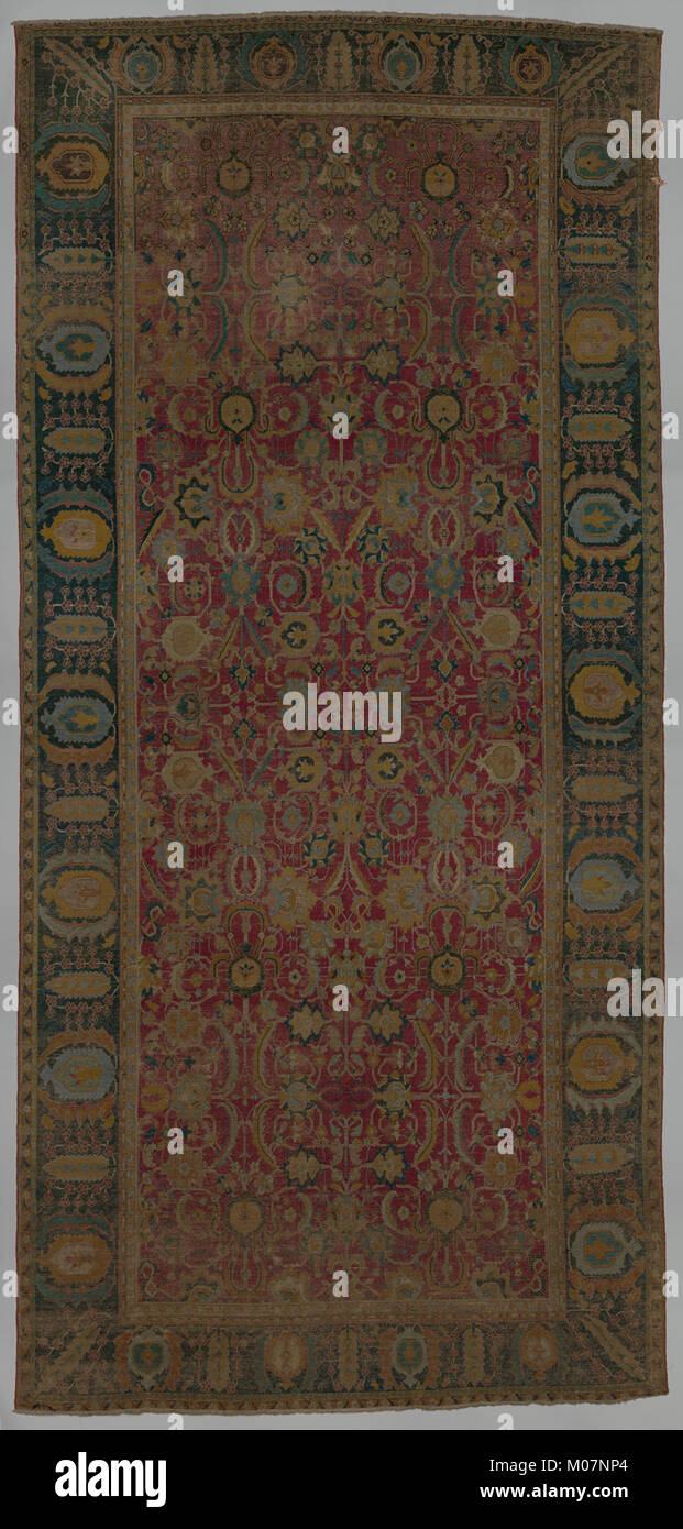 Indo-Persian carpet with repeat pattern of vine scrolls and palmettes MET DP265200 Stock Photo