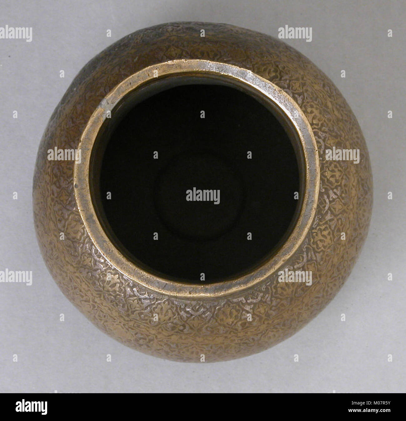 This inlaid ewer is a finely crafted vessel, featuring detailed inlays ...