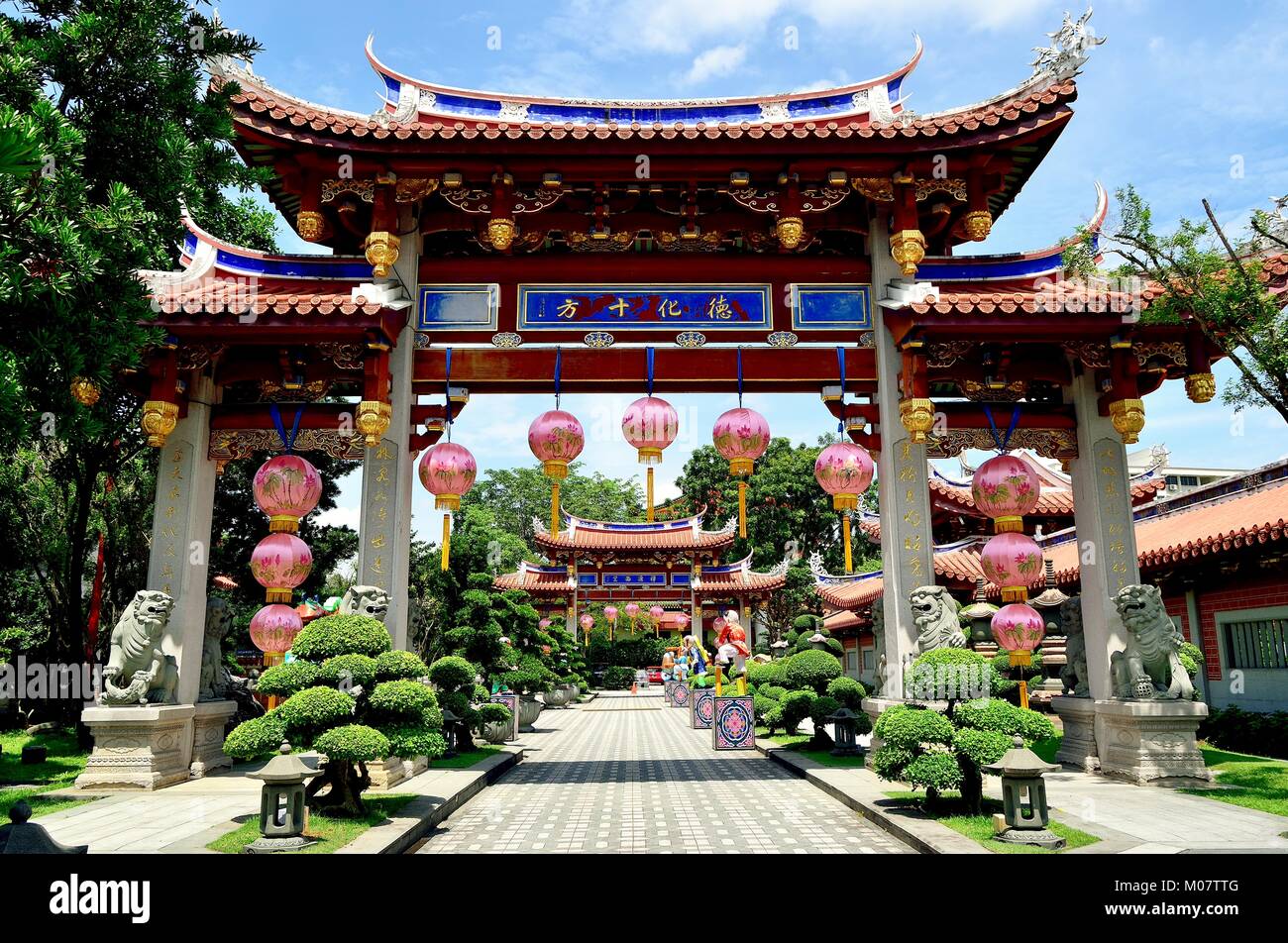 Beautiful pink Chinese lanterns hanging from a classical archway celebrating Chinese Lunar New Year at Siong Lim Buddhist Monastery in Singapore Stock Photo