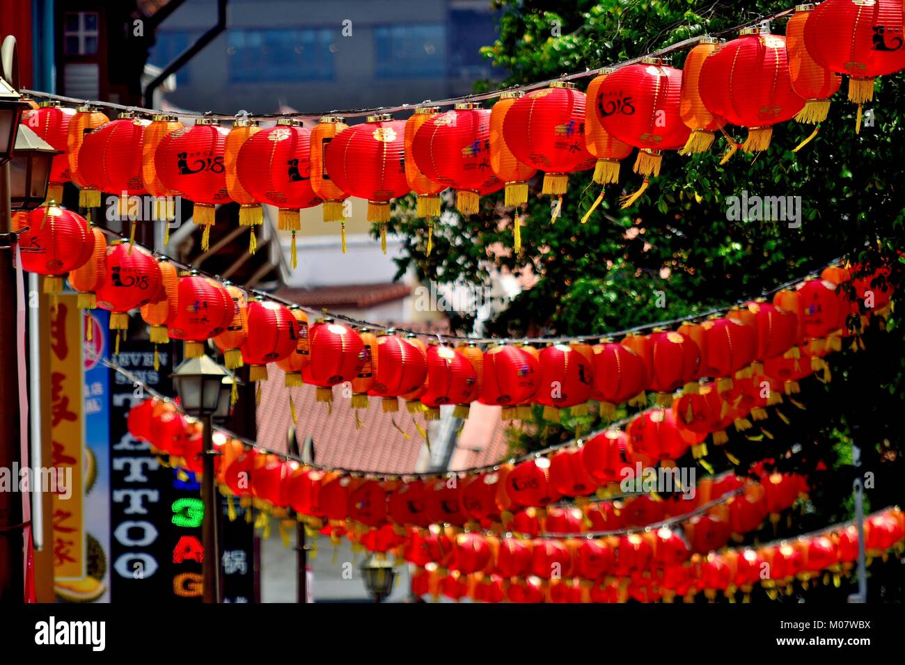 Red Chinese lanterns hanging across a street in historic Chinatown ...