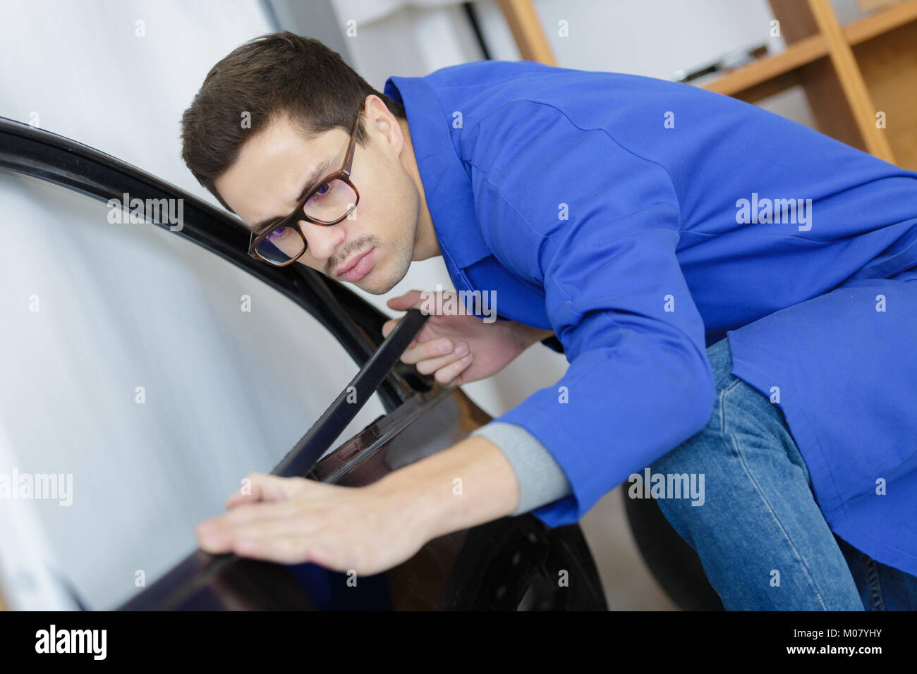 man hands repair left door car Stock Photo