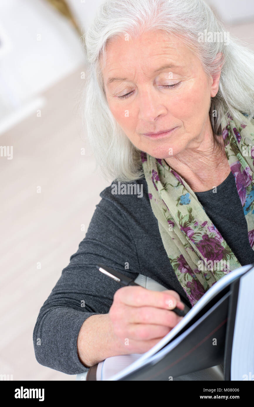 old woman writing notes at home Stock Photo - Alamy