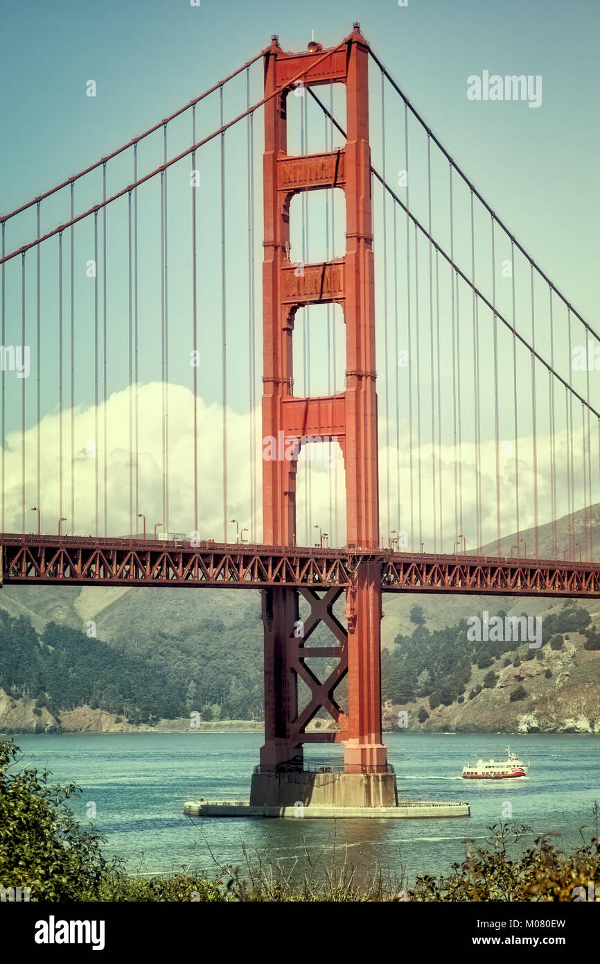 Golden Gate Bridge in retro color. Vertical close up. Stock Photo