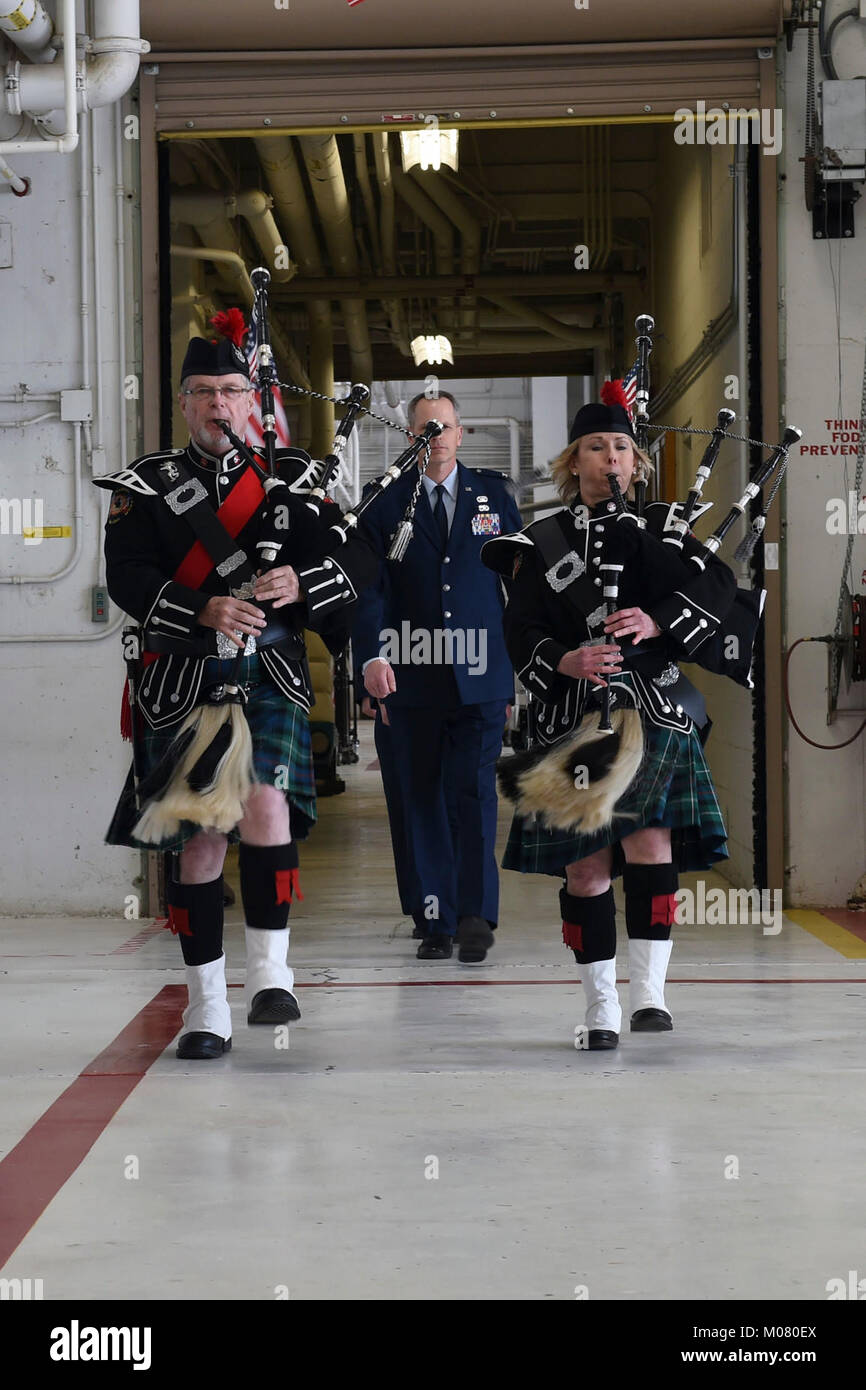 The official party arrive marching behind bagpipers during the 233 Intelligence Squadron change of command ceremony on January 6, 2018, 132d Wing, Des Moines, Iowa. Lt. Col. Nunn is the second commander of the 233d IS since it was activated. (U.S. Air National Guard Stock Photo