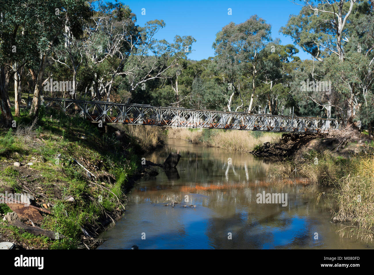 Kangarilla, South Australia, Australia: July 1, 2017 - Old disused and partially dismantled bridge crossing the Onkaparinga River on Mount Bold Road n Stock Photo
