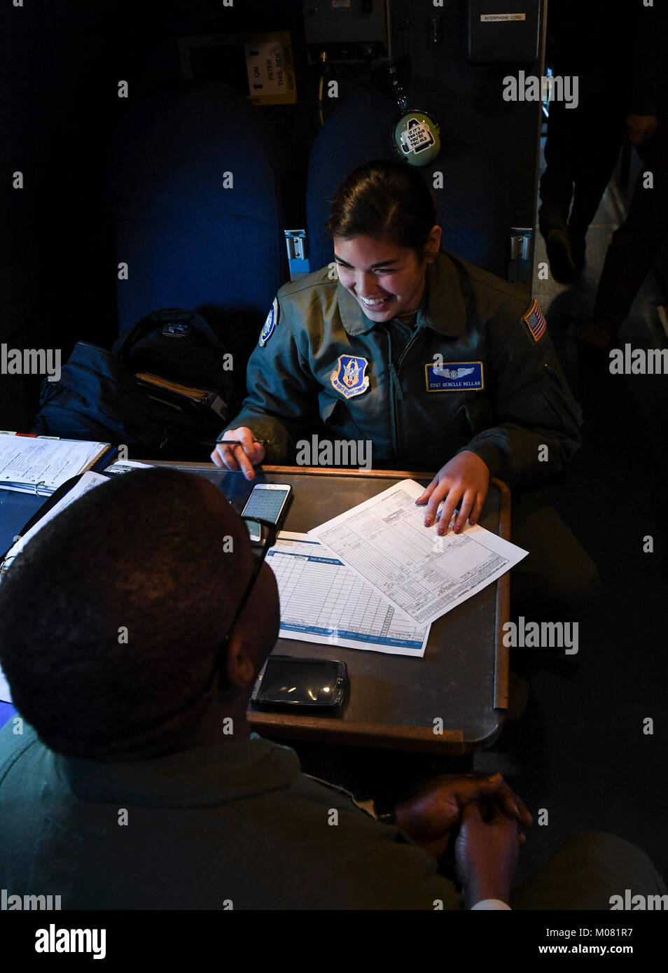 Staff Sgt. Genelle Bellar and Master Sgt. Leo C. Martin, 709th Airlift Squadron loadmasters, work to calculate the total weight of the C-5M Super Galaxy from Dover Air Force Base, Del., on the flightline at Barksdale Air Force Base, La., Jan. 12, 2018. The total weight of the aircraft is needed to determine the speed in which the aircraft must be at to properly take off. (U.S. Air Force Stock Photo