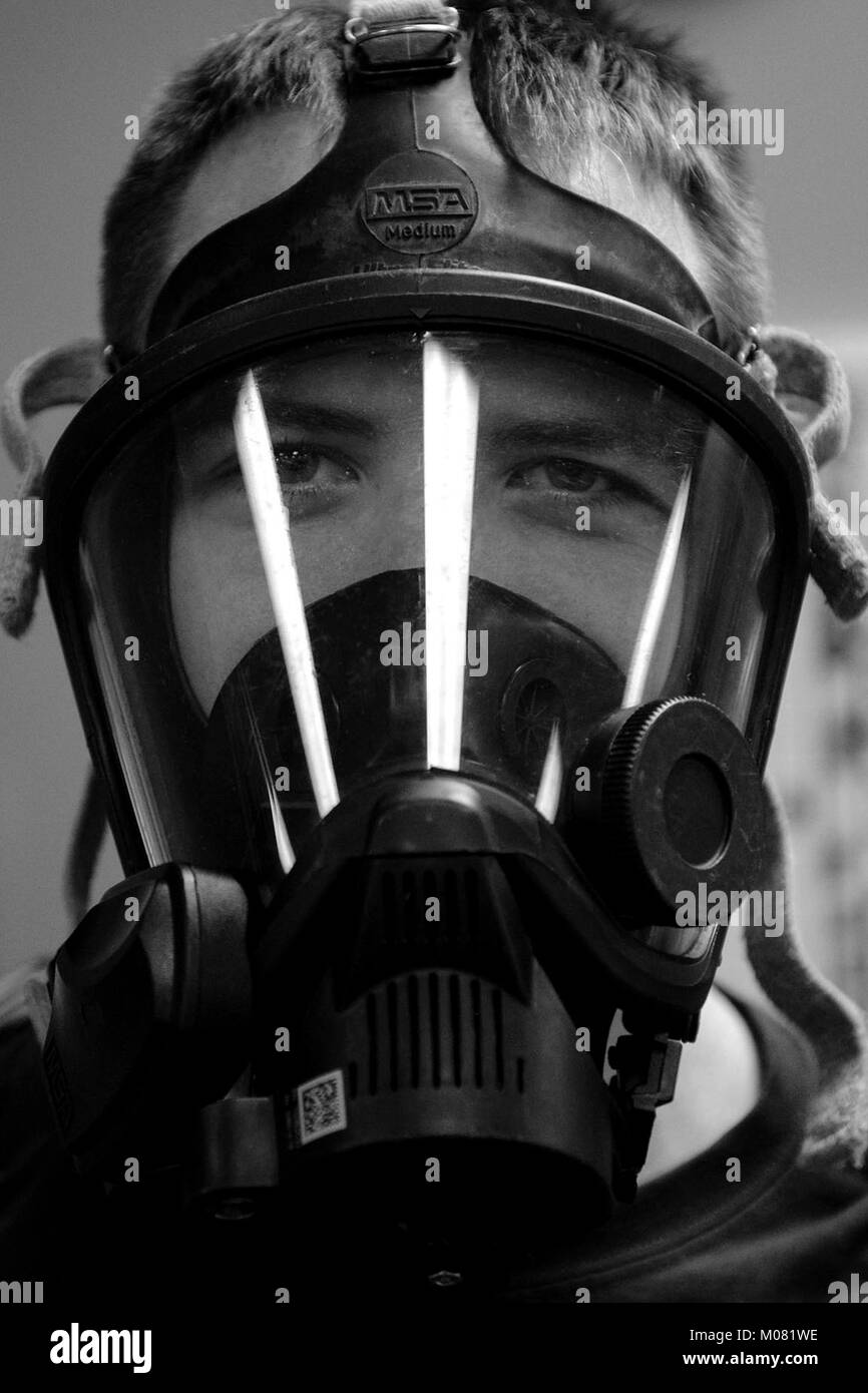 2nd Lt. Eric Olson, 23d Aerospace Medicine Squadron bioenvironmental engineer, gears up during readiness training, Jan. 12, 2018, at Moody Air Force Base, Ga. The Bioenvironmental Engineering Flight tested their response capabilities in a simulated contamination scenario. Bioenvironmental engineering specialists focus on reducing health hazards in the workplace and surrounding areas. (U.S. Air Force Stock Photo