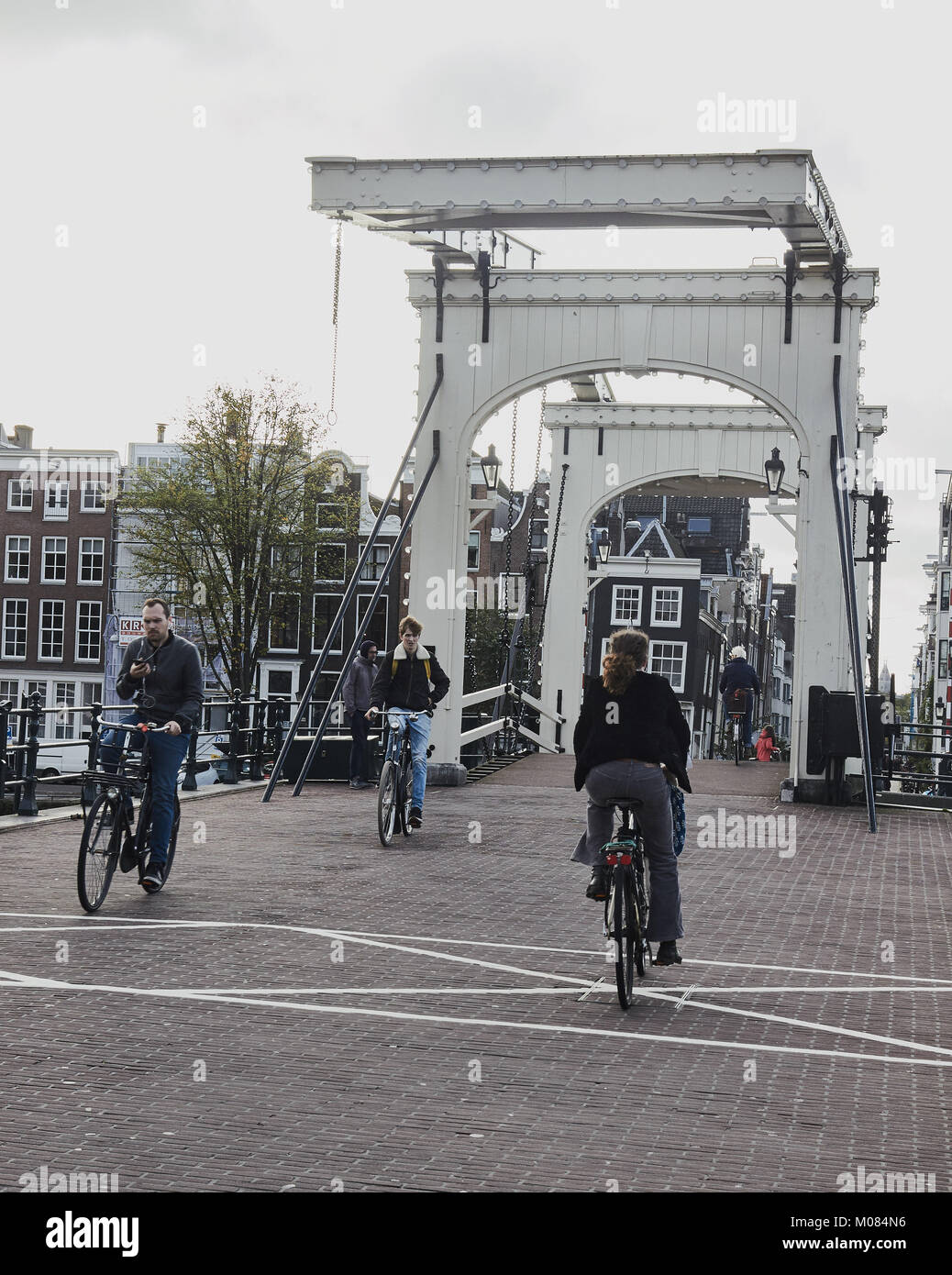 Magere Brug (skinny bridge) a pedestrian and bicycle bascule bridge across the Amstel river, Amsterdam, Netherlands Stock Photo