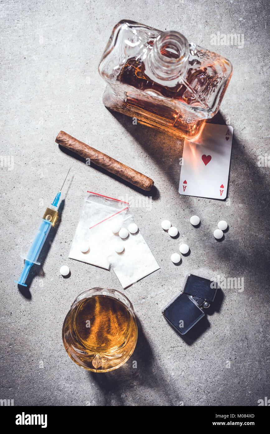 Hard drugs and alcohol on gray