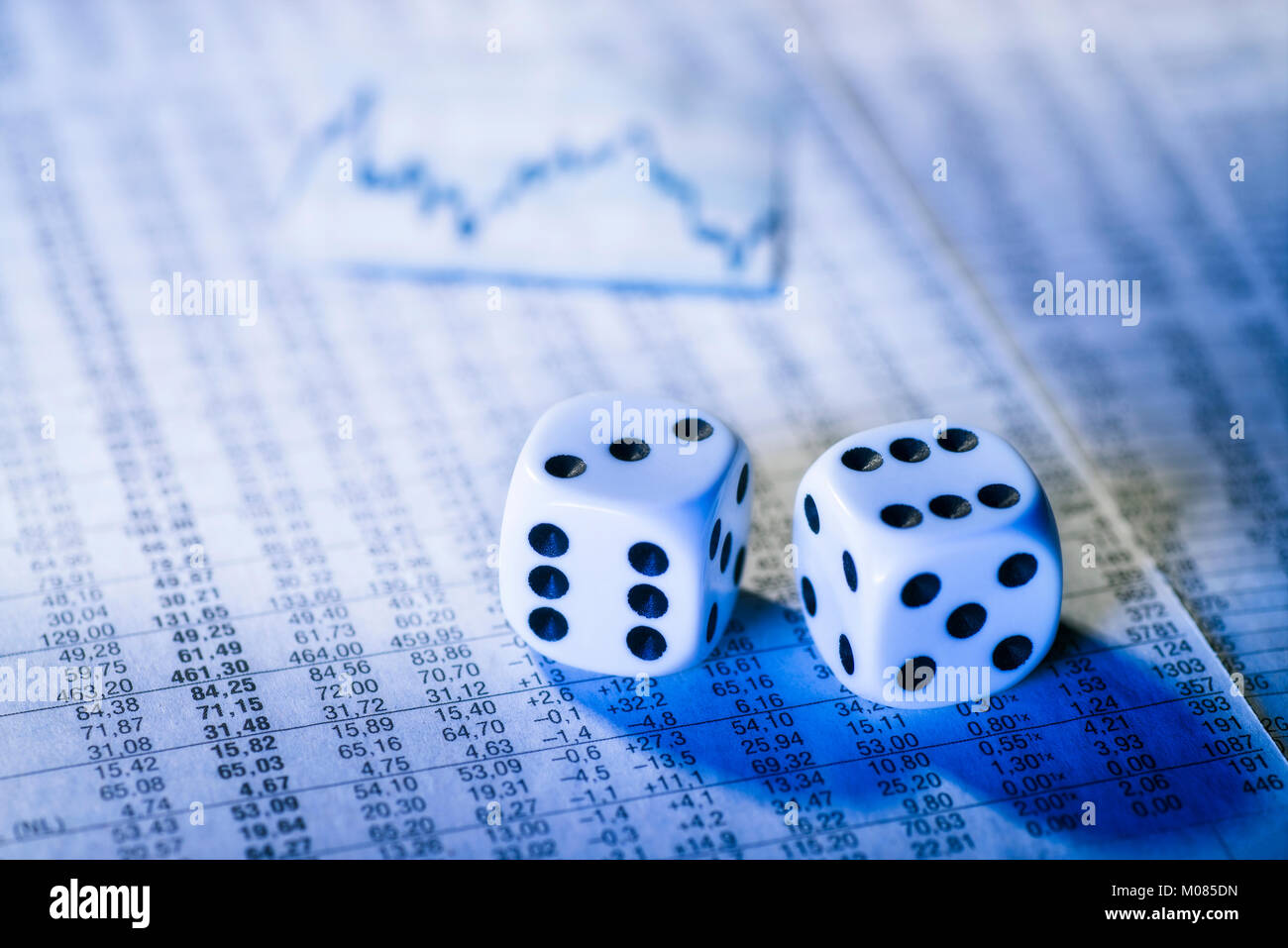 Two dice on a chart with stock prices Stock Photo Alamy