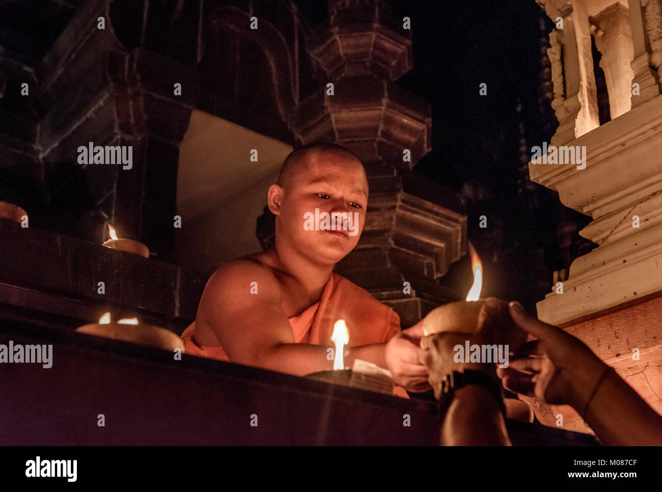 Novice Monks conducting prayers at Yi Peng Festival, Chiang Mai, Thailand Stock Photo