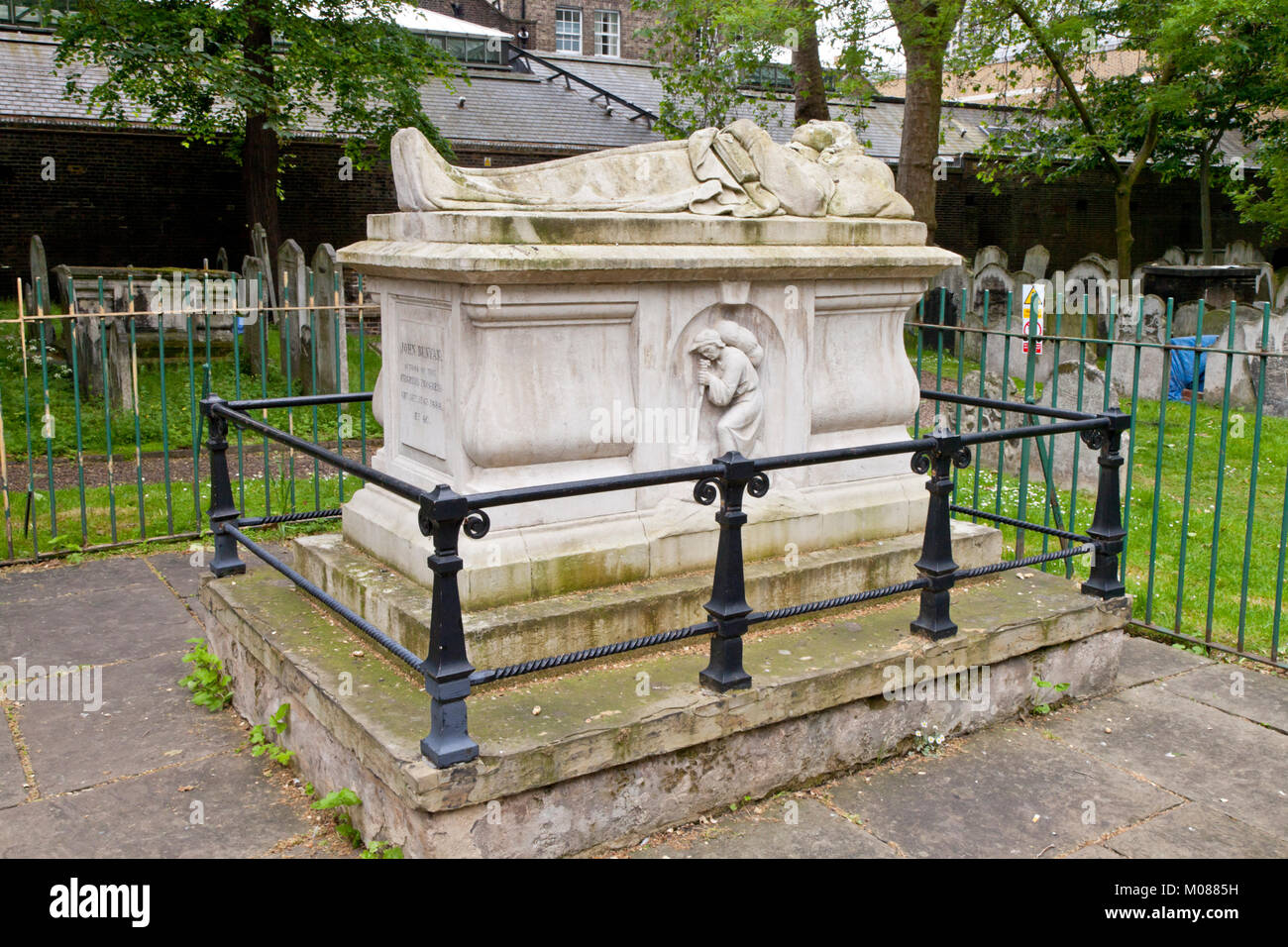John Bunyan's tomb in Bunhill Fields, a fomer burial ground, in Islington, North London,  UK Stock Photo