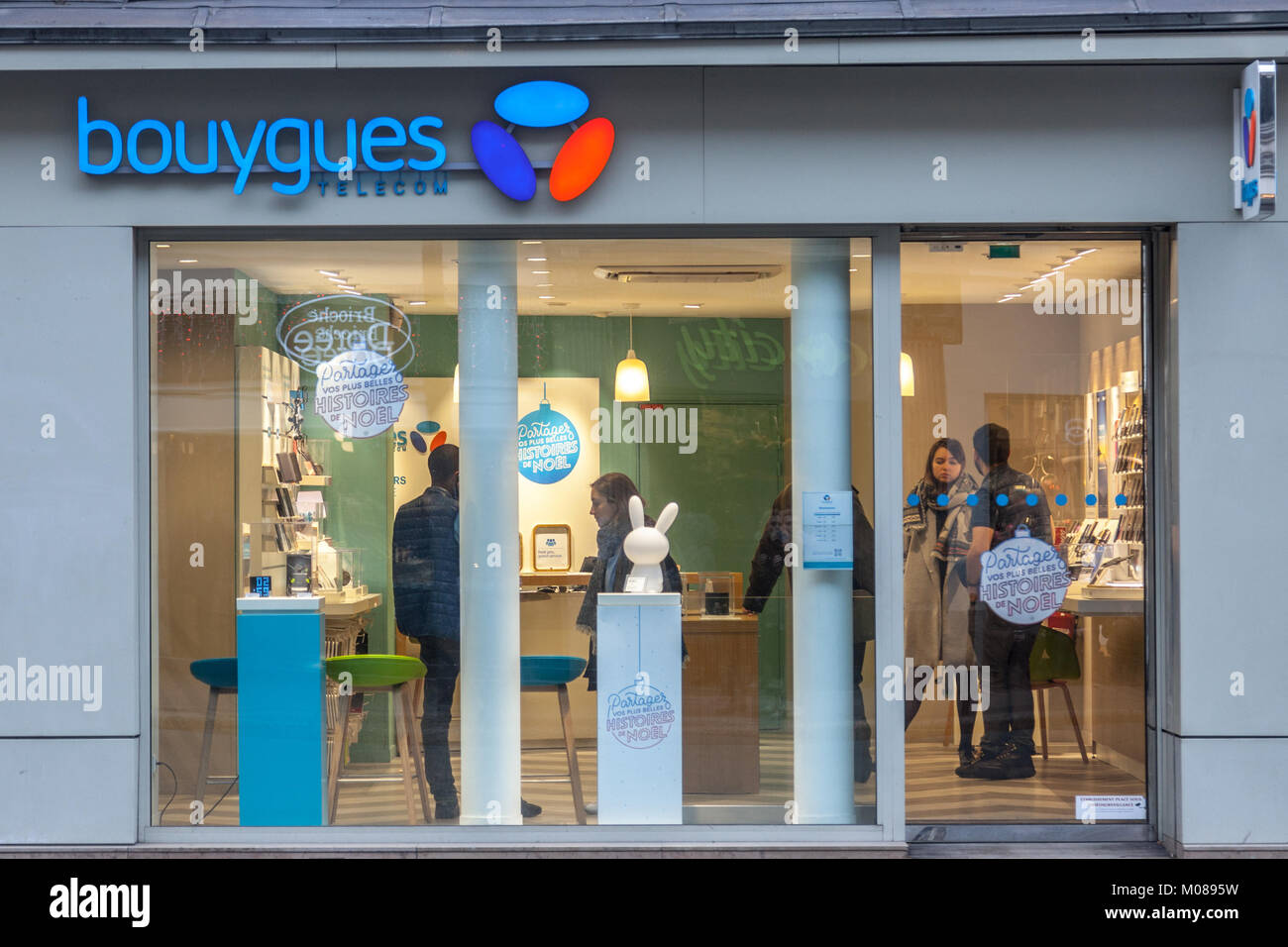 PARIS, FRANCE - DECEMBER 20, 2017: Bouygues Telecom logo on their main shop on Rue de Rivoli avenue. Bouygues Telecom is a French mobile phone, Intern Stock Photo