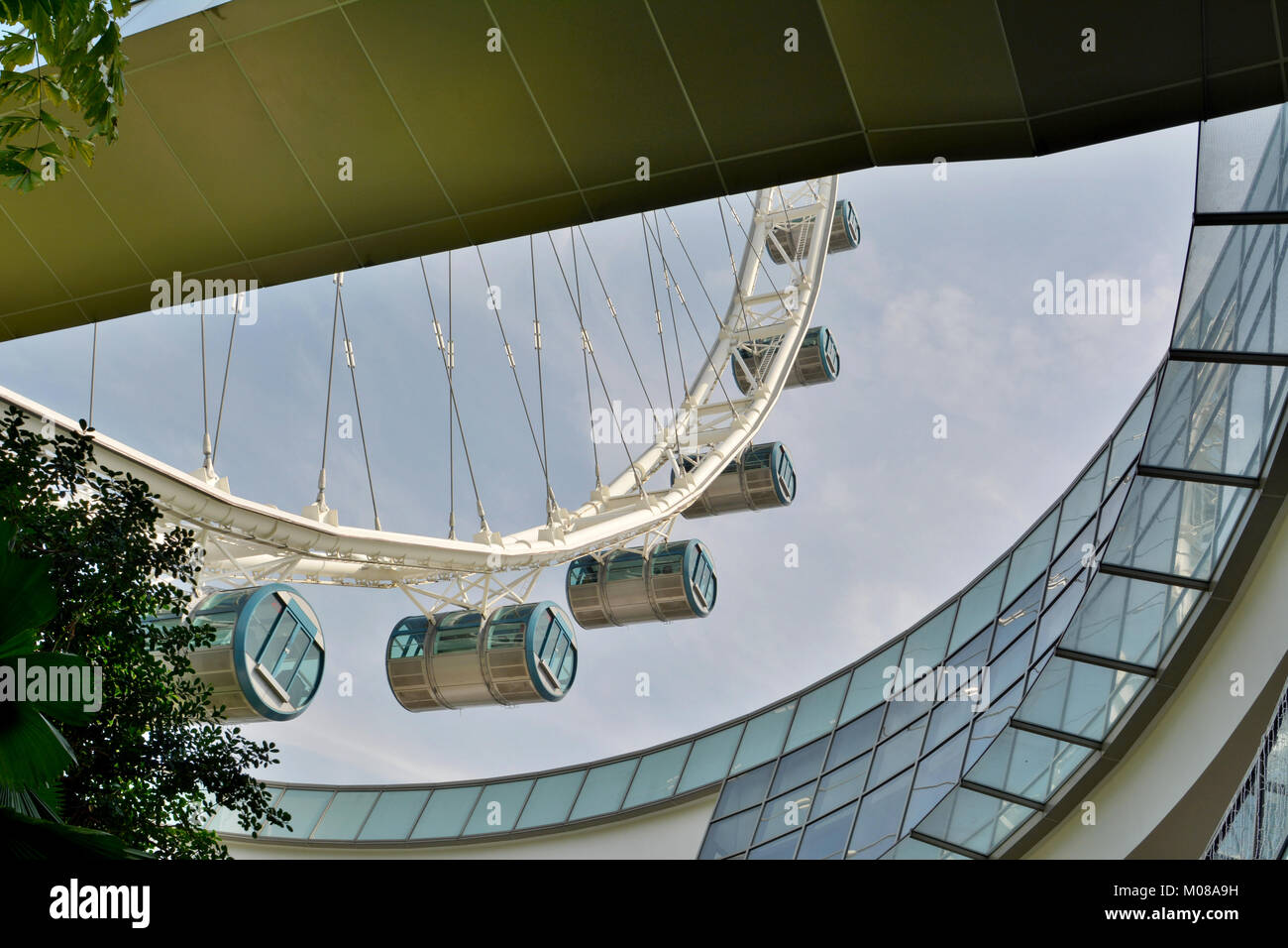 Singapore, Singapore - December 11, 2017. Elements of design of Singapore Flyer observation wheel complex, with wheel capsules holding people. Stock Photo