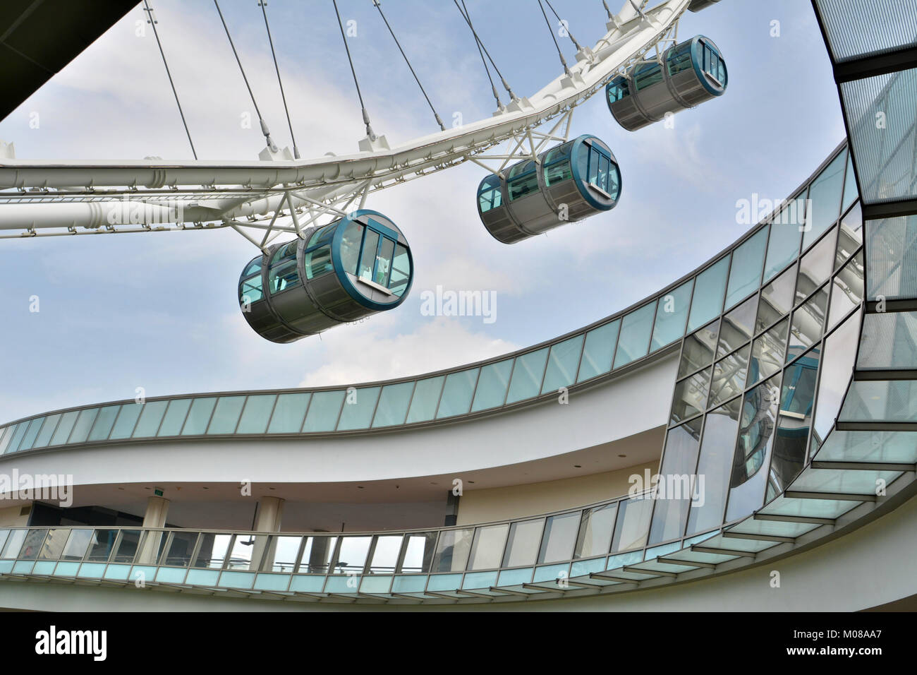 Singapore, Singapore - December 11, 2017. Elements of design of Singapore Flyer observation wheel complex, with wheel capsules holding people. Stock Photo