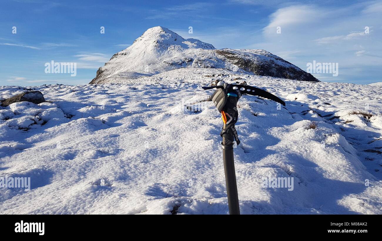Hiking to the summit of Mam na Gualainn part of the Mamore mountain range in Scotland during winter is not an adventure for the inexperienced - the weather changes and low temperatures mean that proper equipment is needed. Stock Photo