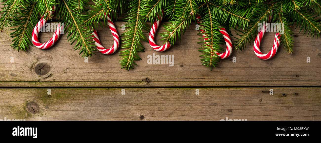 Christmas background with tree and candy canes Stock Photo - Alamy