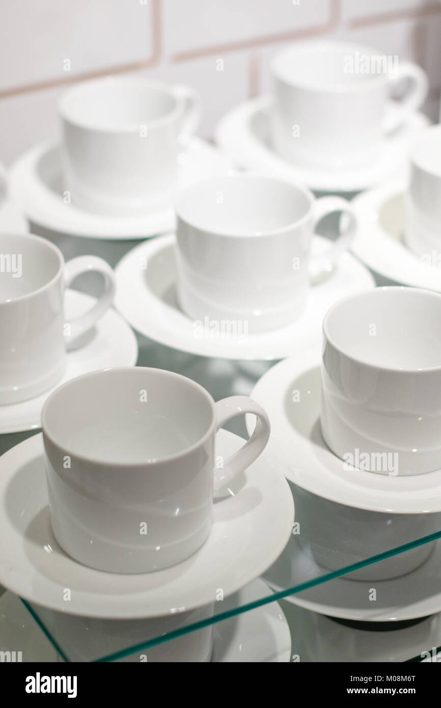 White ceramic cups set on display Stock Photo