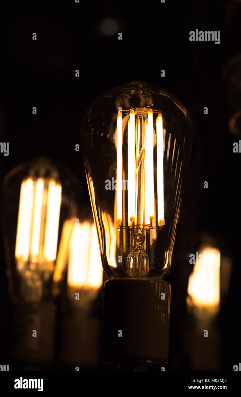 Decorative antique edison style light bulbs are in fact contamplorary LED light bulds made to look like old school. Creating old style look and saving Stock Photo