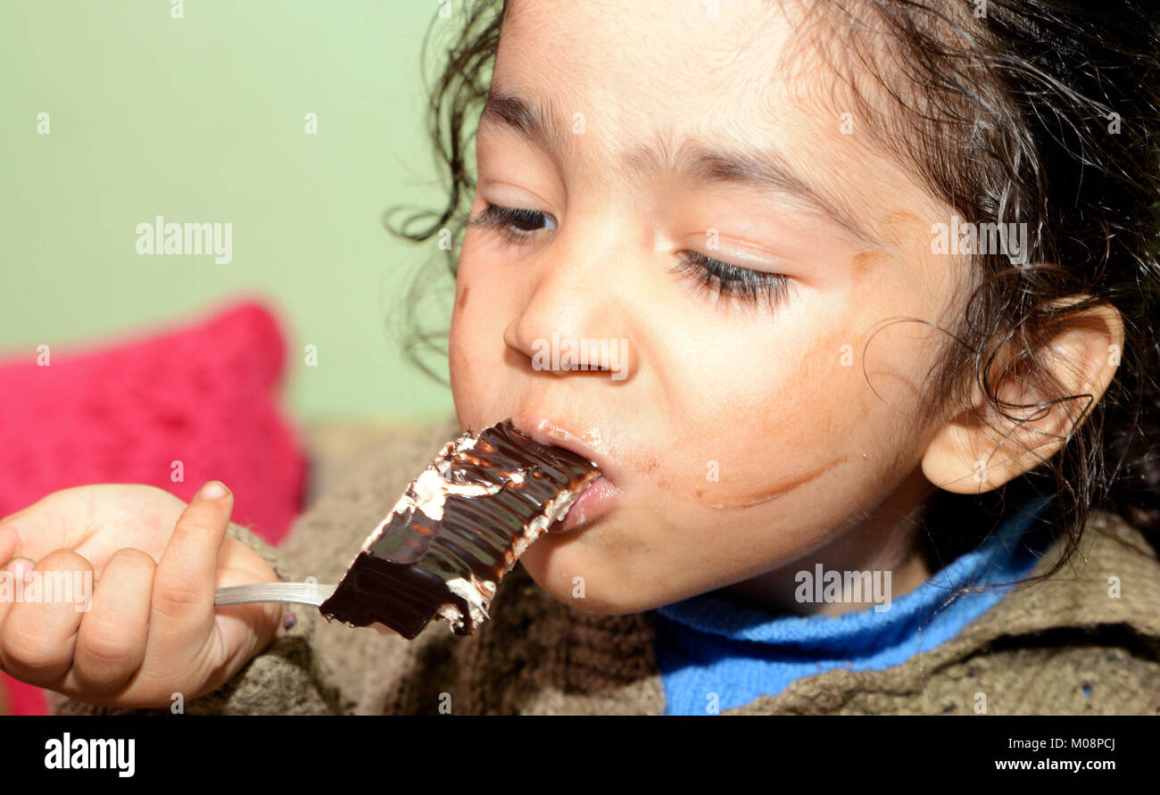 Little boy eating cake Stock Photo Alamy