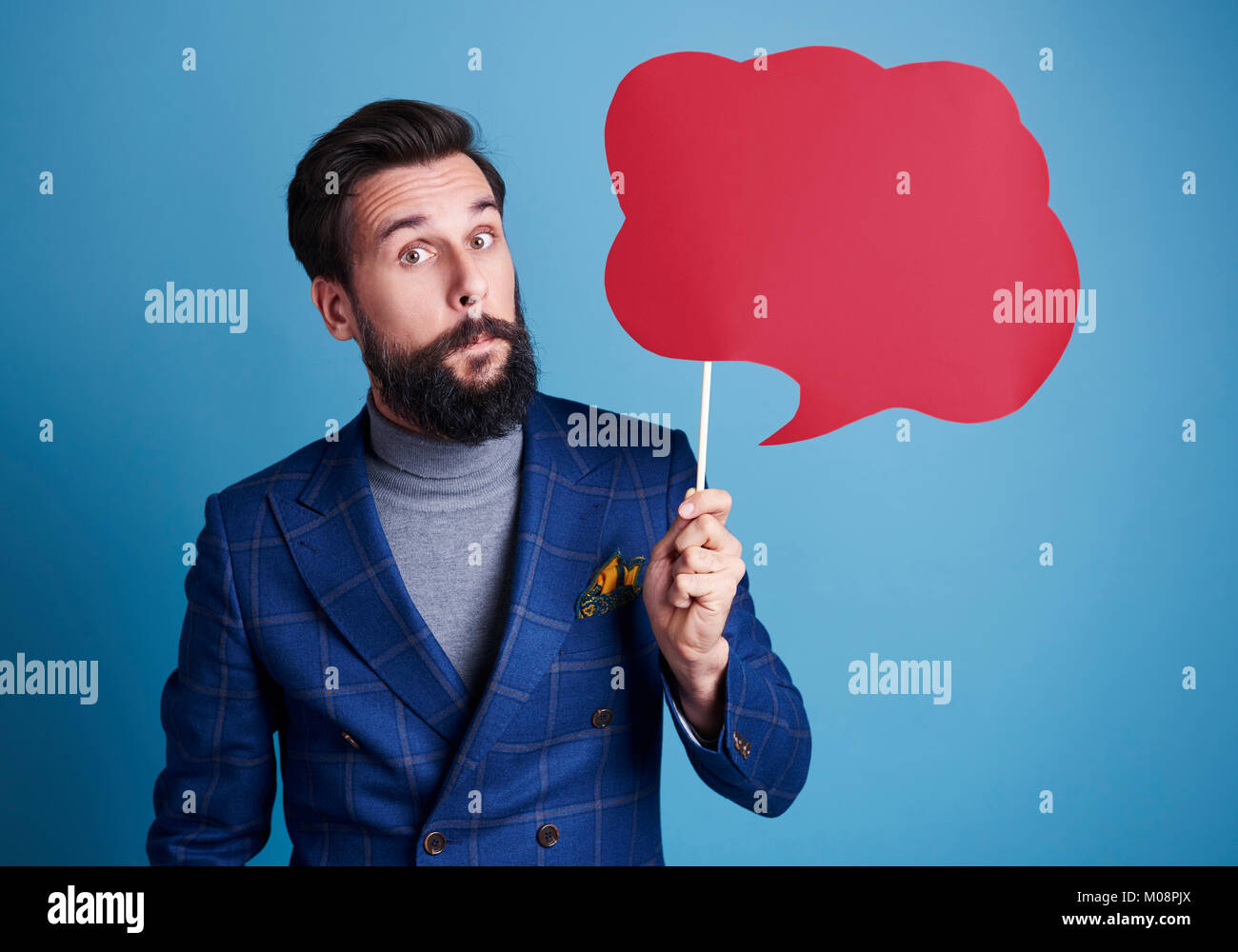 Man holding a speech bubble Stock Photo