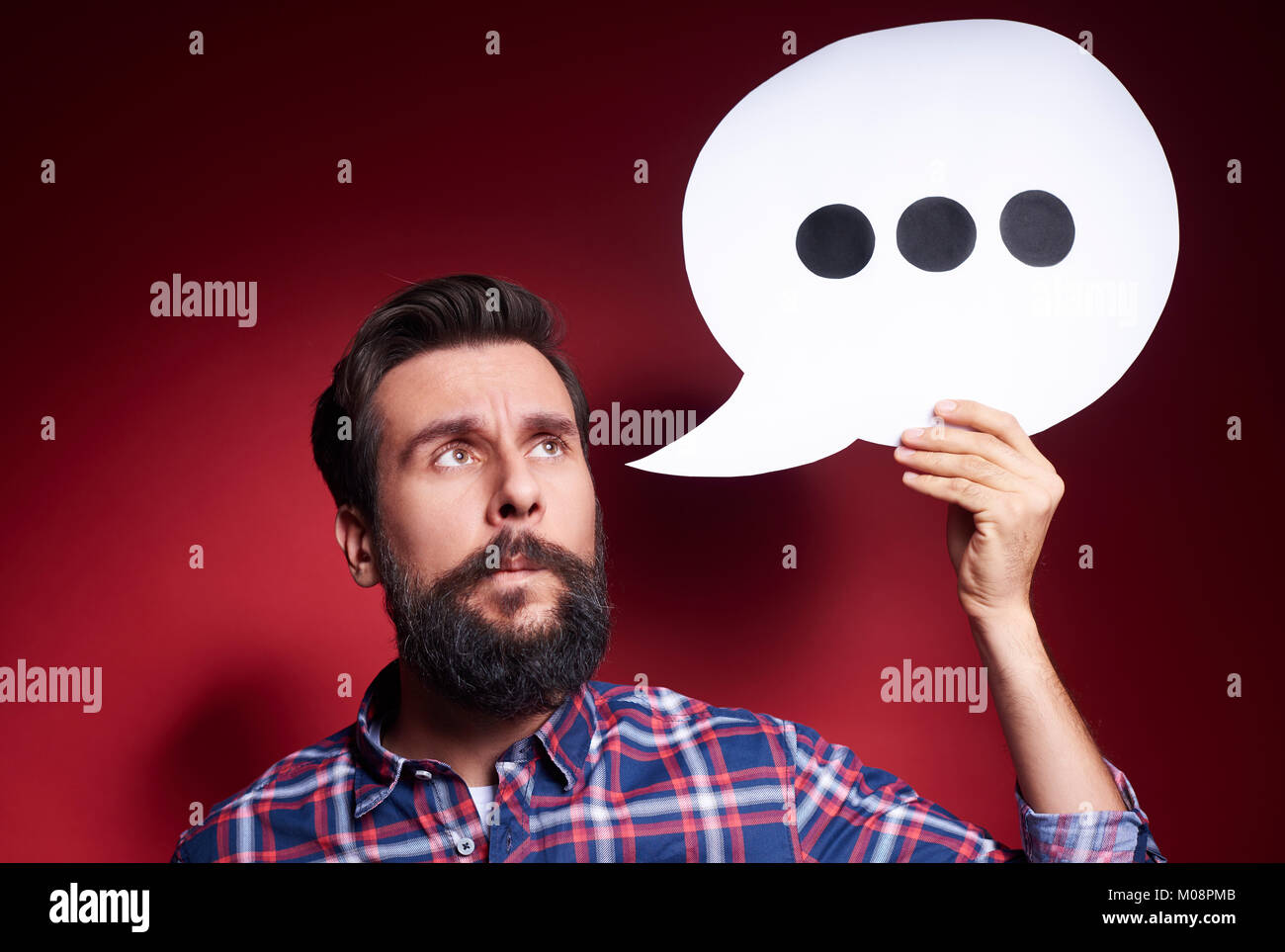 Thoughtful man with thinking bubble Stock Photo