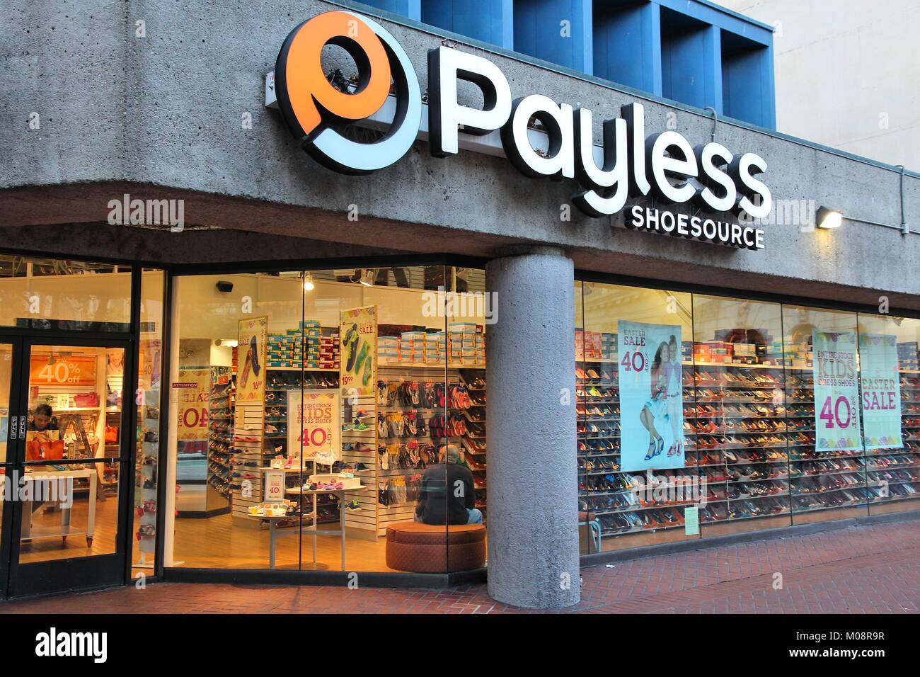 SAN FRANCISCO, USA - APRIL 8, 2014: Shoppers visit Payless Shoesource footwear store in San Francisco, USA. There were approximately 660 Payless ShoeS Stock Photo