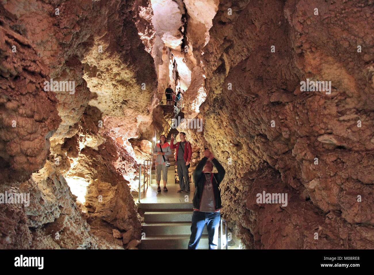 BUDAPEST, HUNGARY - JUNE 21, 2014: People visit Szemlohegyi Cave in Budapest. Budapest has the largest thermal water cave system in the world. Stock Photo