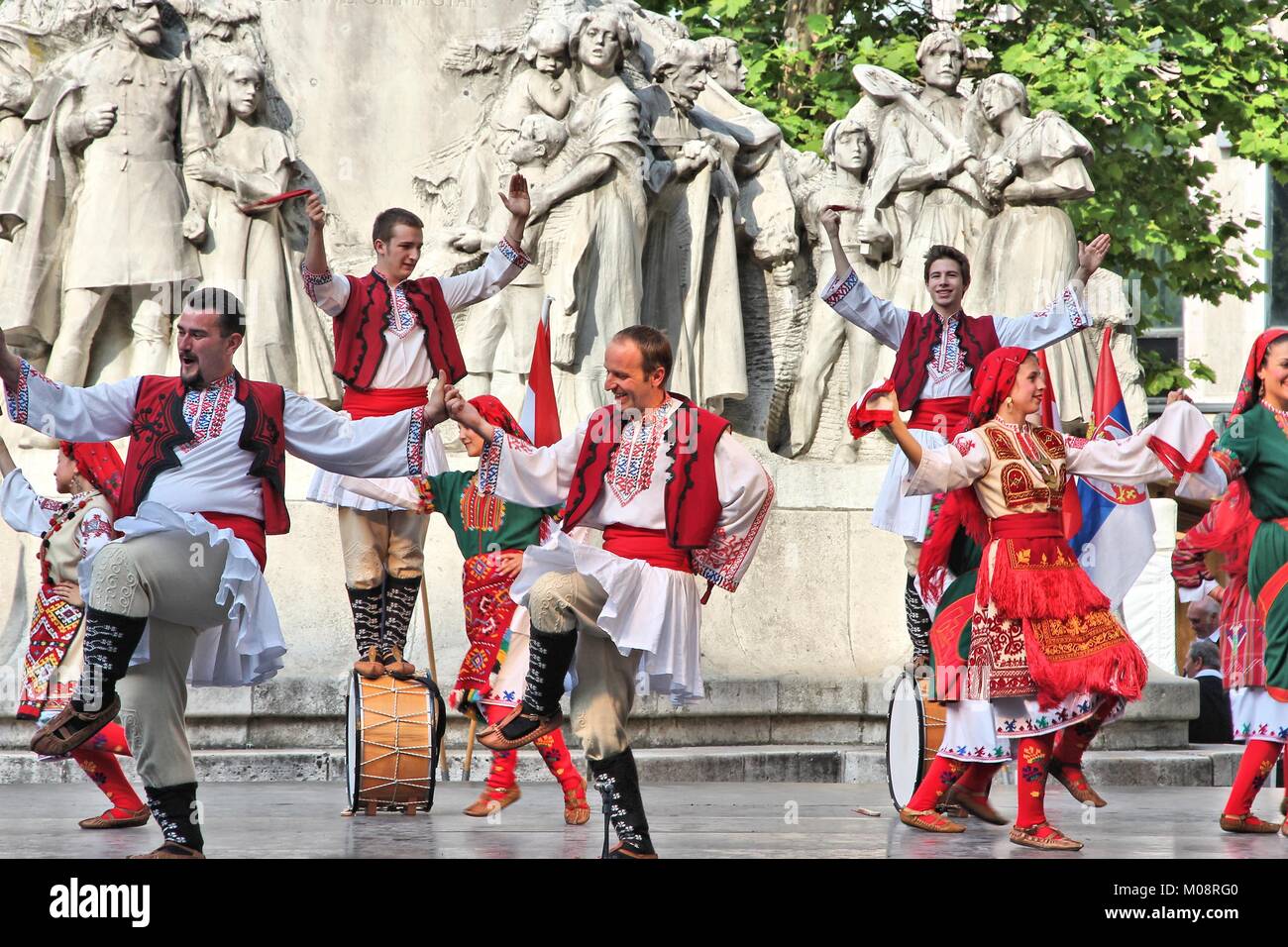 BUDAPEST, HUNGARY - JUNE 19, 2014: Bulgarian folk dance group JANTRA performs on street in Budapest. The group performs since 1996. Stock Photo