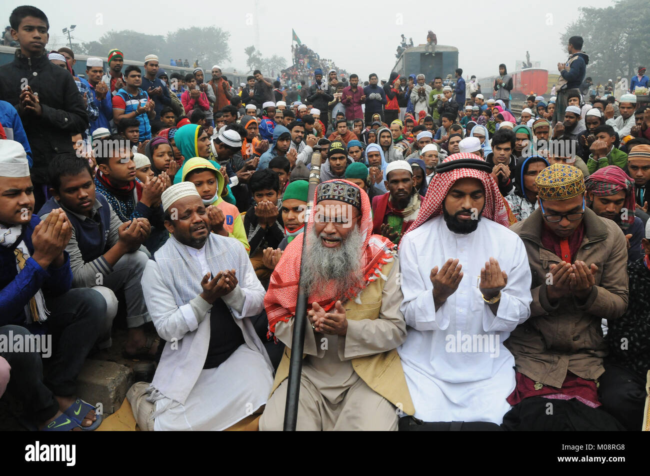Bangladeshi Muslim devotees take part Akheri Munajat or the final prayer on the last day of Biswa Ijtema, the second largest World Congregation of Mus Stock Photo