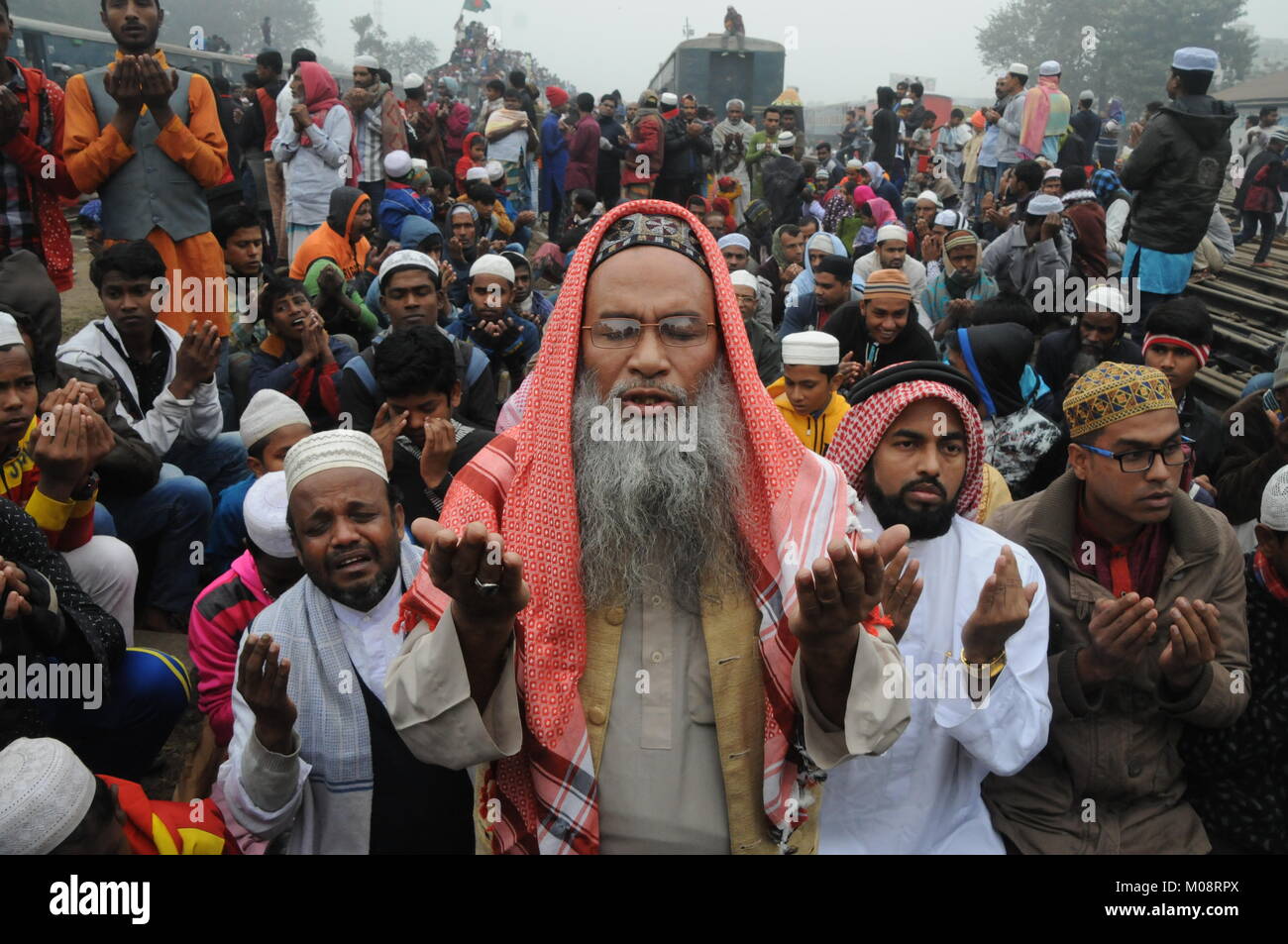 Bangladeshi Muslim devotees take part Akheri Munajat or the final prayer on the last day of Biswa Ijtema, the second largest World Congregation of Mus Stock Photo