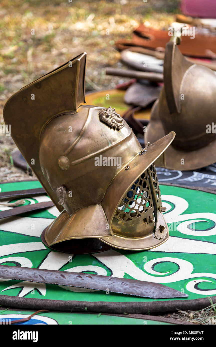 Helmets of armor and swords on the medieval military shield. Useful for
