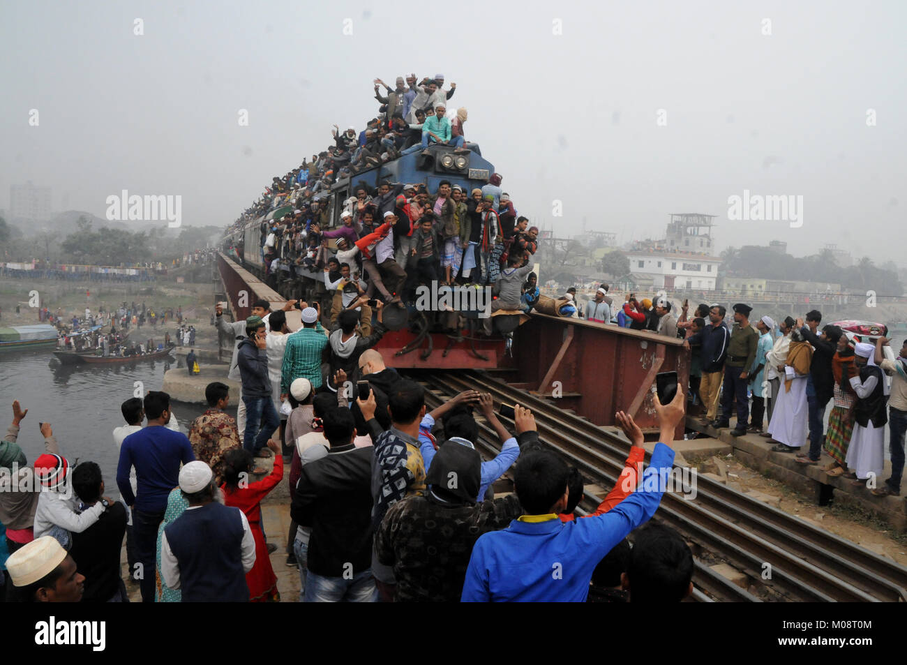 Bangladeshi Muslim devotees return home in an over-crowded train after attends the Akheri Munajat or the Final Prayer on the last day of Biswa Ijtema, Stock Photo