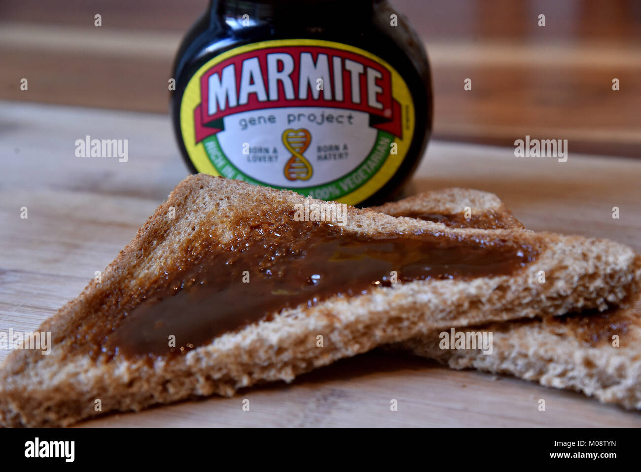 A jar of Marmite with brown bread toast Stock Photo Alamy