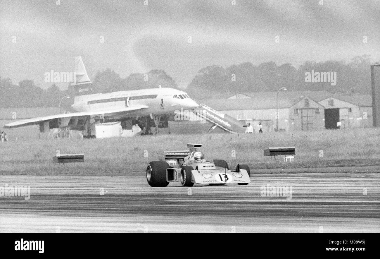 With the Anglo-French supersonic airliner Concorde providing the backdrop, female Racing driver Divina Galica roars down the runway at RAF Fairford on her way to four British Racing car speed records. Stock Photo