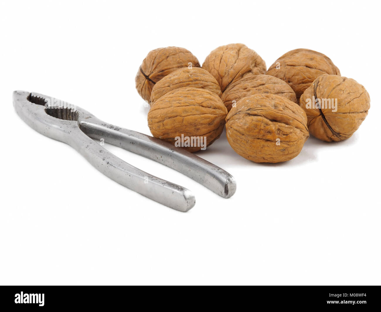 Food, group of walnuts and one nutcracker Stock Photo